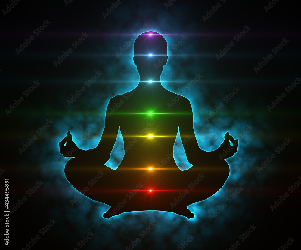 Glowing aura and chakras on meditating figure in yoga lotus pose - obrazy, fototapety, plakaty 