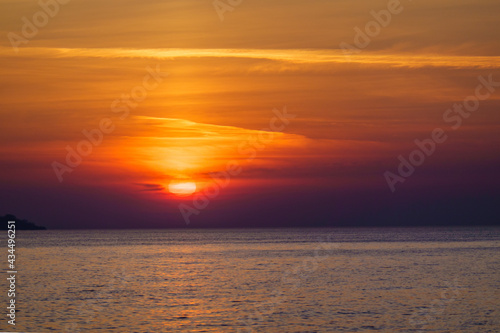 Scenic sunset over calm sea © Anton Gvozdikov