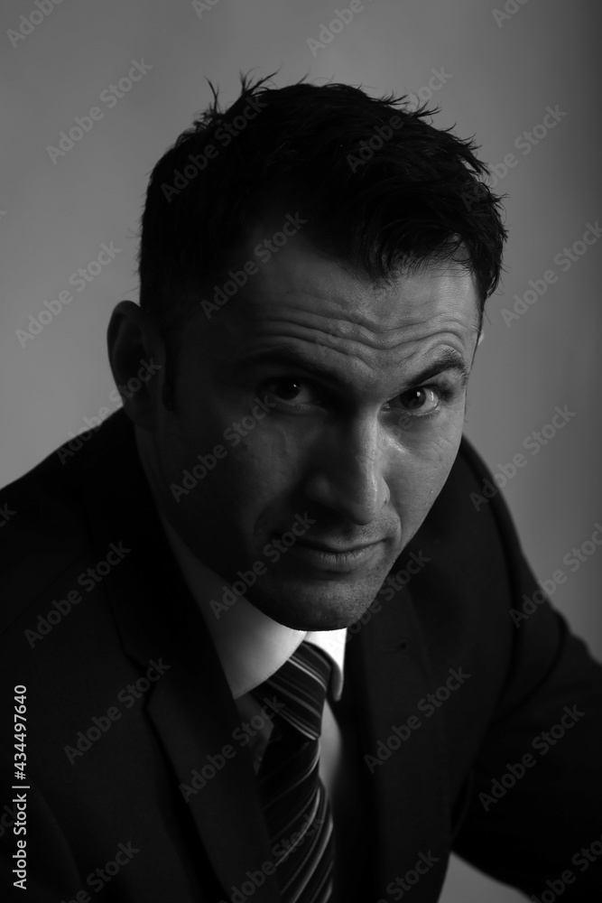 Black and white portrait of a man in jacket