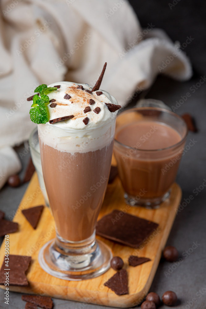 Glass of chocolate milk on the dark background. Glass of chocolate milk on the dark background.