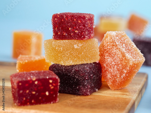 Fototapeta Naklejka Na Ścianę i Meble -  A colorful traditional French fruit jellies (Pâte de fruits). It's a sweet dessert which is main ingredients are concentrate fruits paste, sugar and pectin surrounding with sugar crystal 
