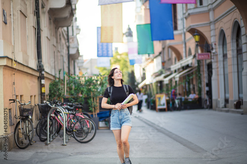 Wallpaper Mural Woman on street with map in hands. Torontodigital.ca