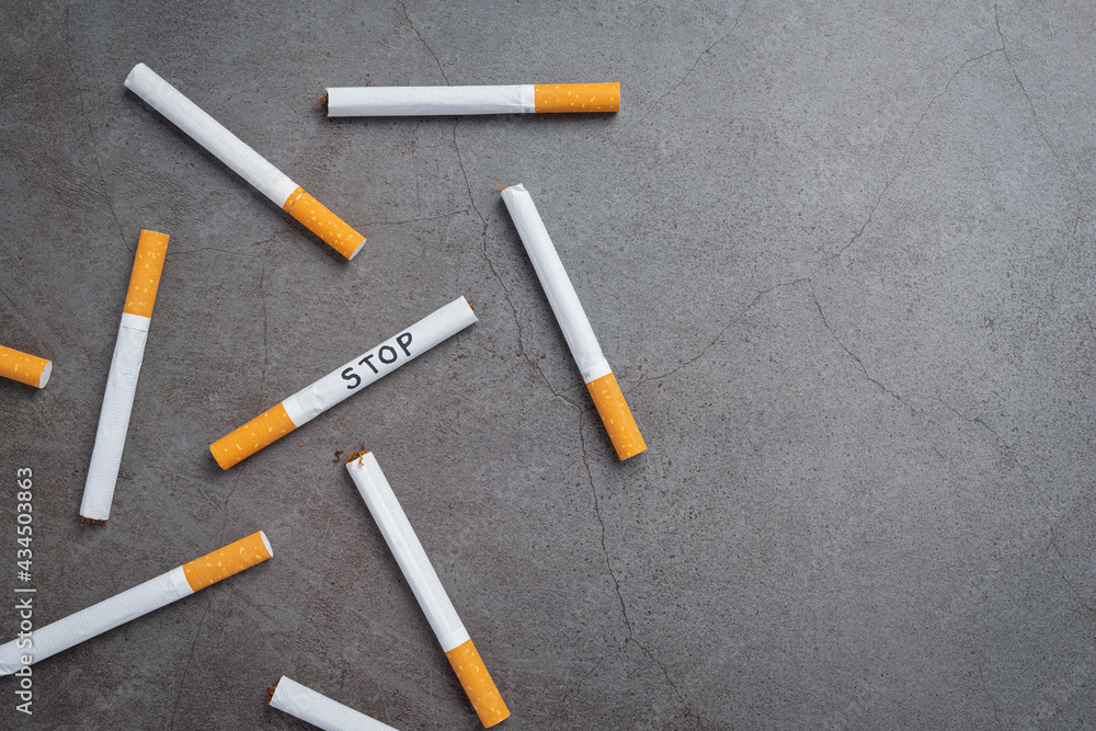 cigarette on the dark background.World no Tobacco day concept. cigarette on the dark background.World no Tobacco day concept.