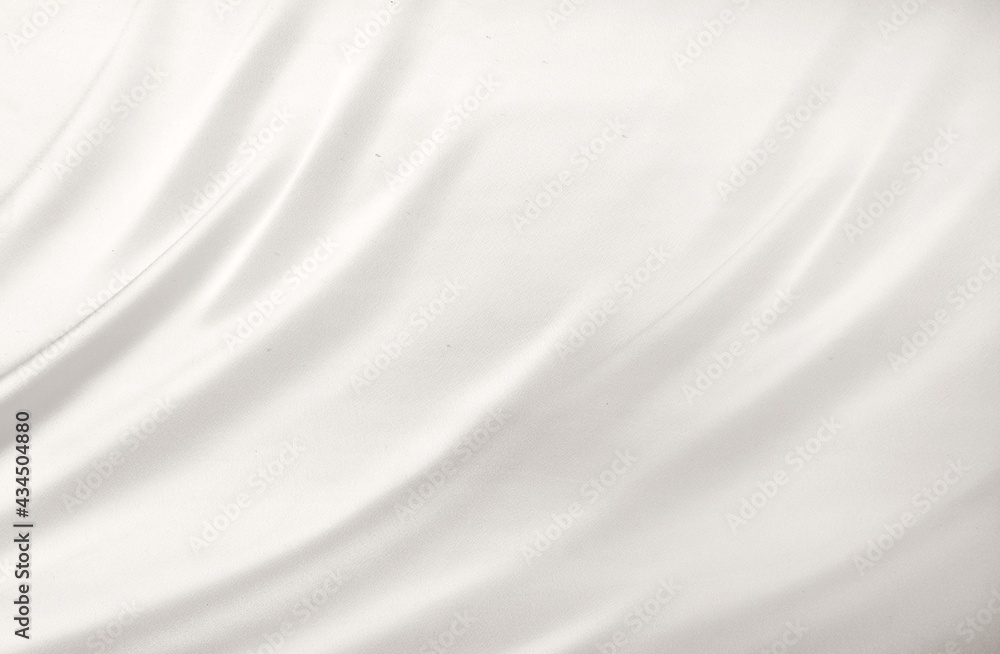 Smooth elegant white silk or satin luxury cloth texture can use as wedding background. Luxurious background design. White silver fabric silk background with beautiful soft blur pattern natural. Smooth elegant white silk or satin luxury cloth texture can use as wedding background. Luxurious background design. White silver fabric silk background with beautiful soft blur pattern natural.
