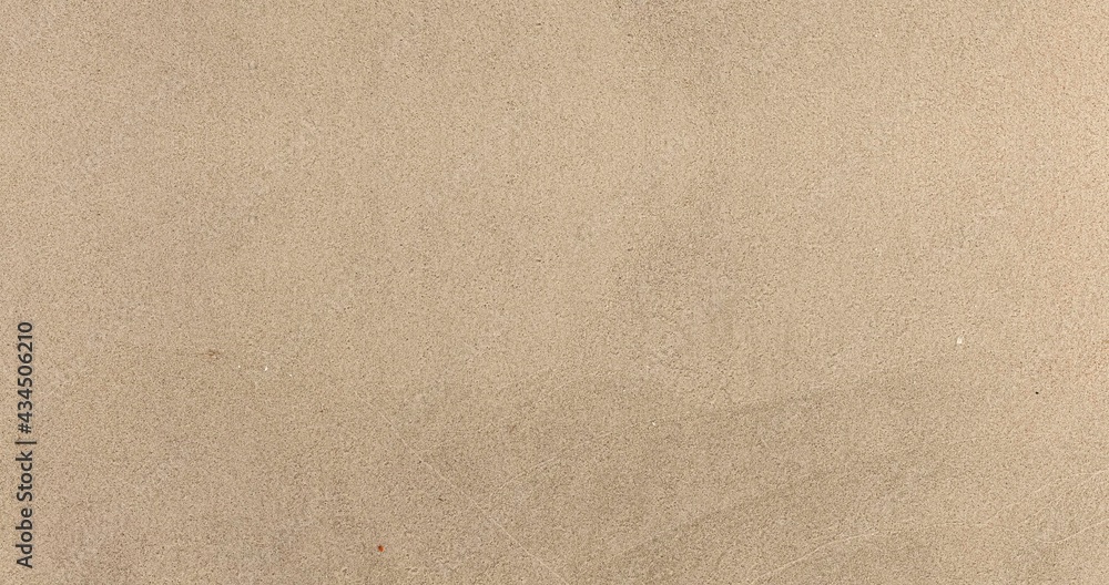 Obraz premium Panorama of Light brown fine-grained sand on the beach texture and background seamless