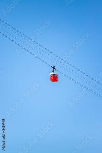 Barcelona in movement cablecar picture taked in a sunny day with a beautiful blue clear sky.