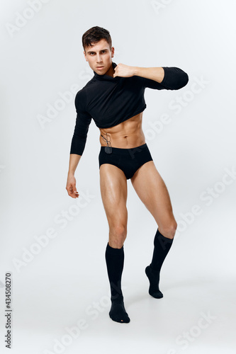 guy model in golf shorts and a sweater on a light background inflated torso bodybuilder © SHOTPRIME STUDIO