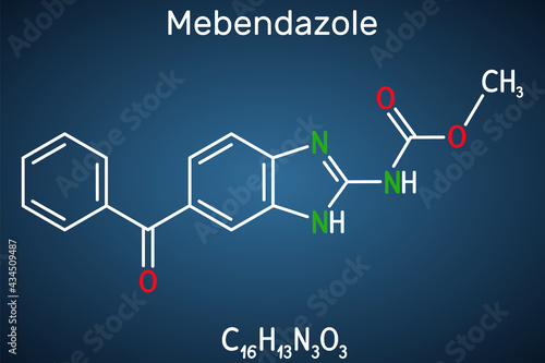 Mebendazole, MBZ molecule. It is synthetic benzimidazole derivate and anthelmintic drug. Structural chemical formula on the dark blue background photo