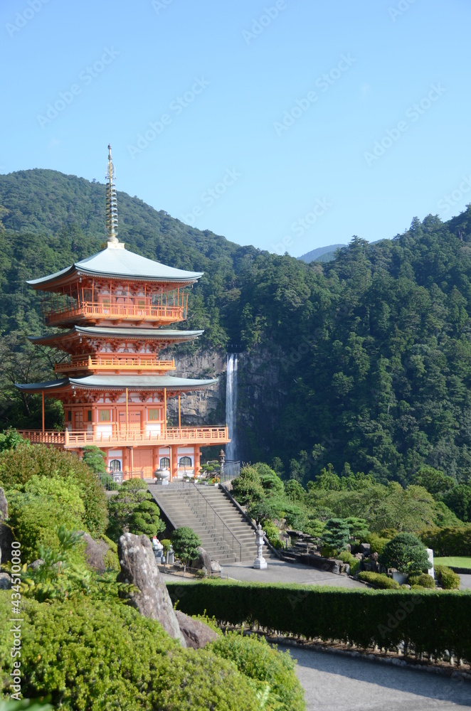 Kumano nachi taisha shrine with waterfall along in view Kumano nachi taisha shrine with waterfall along in view