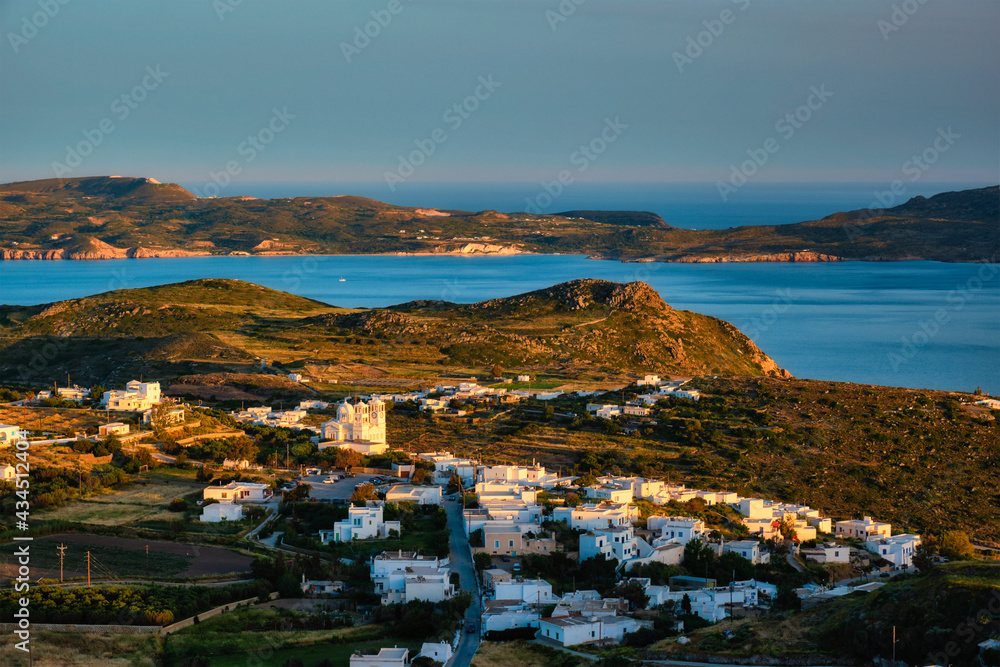 View of Plaka village on Milos island on sunset in Greece