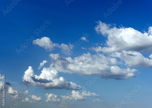 Blue sky with white clouds and sun in sunny summer day. Tranquility  freedom and relaxation concept. High quality photo