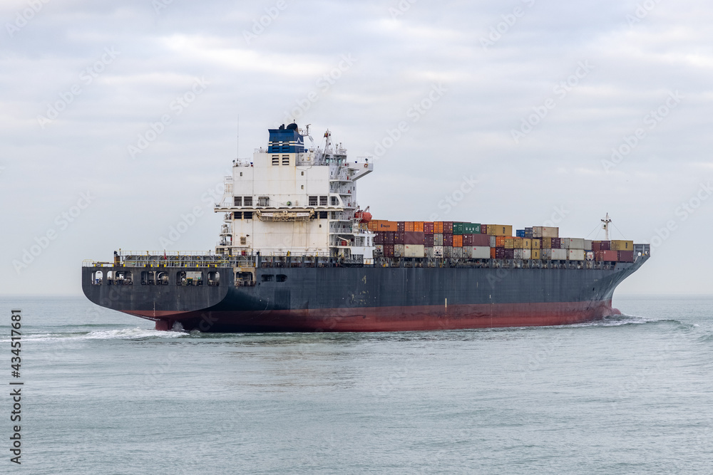 Boat passing by the beach in Vlissingen Holland