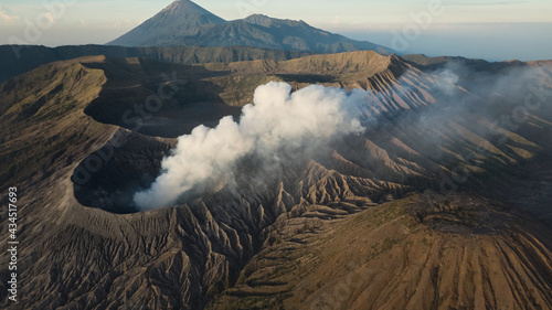 Smoke out of crater of volcano in Indonesia. High angle view of Mount Bromo as active volcano in East Java, Indonesia.