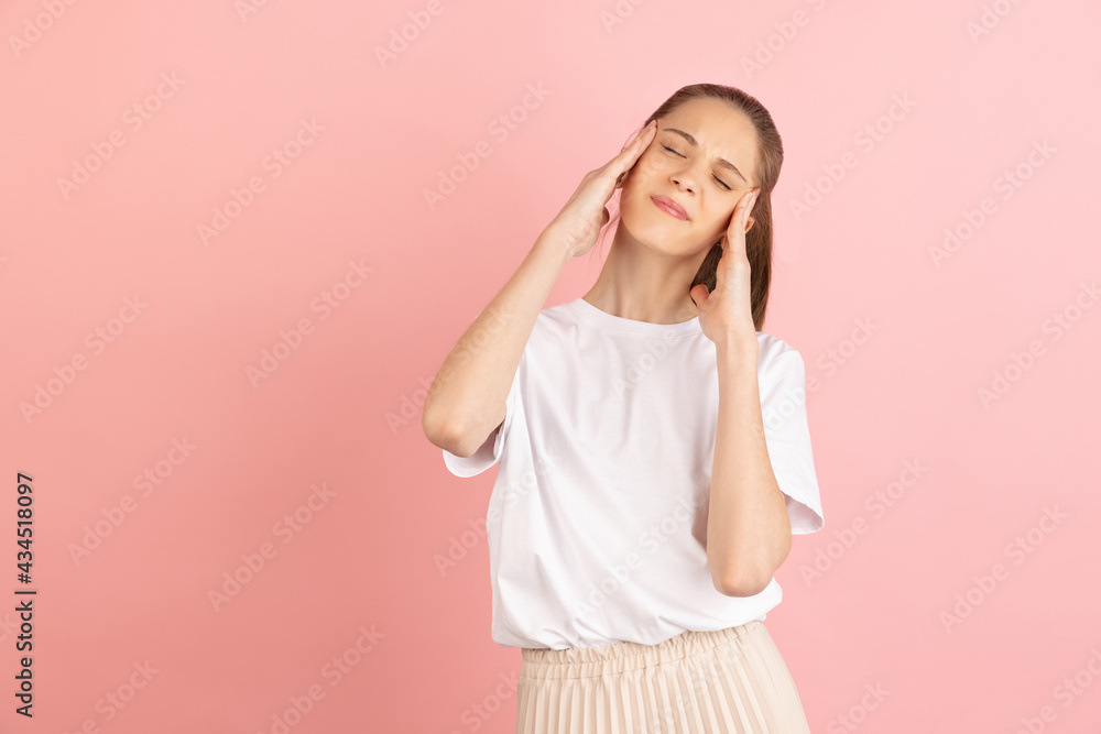 Caucasian young woman's portrait isolated over pink studio background with copyspace Caucasian young woman's portrait isolated over pink studio background with copyspace
