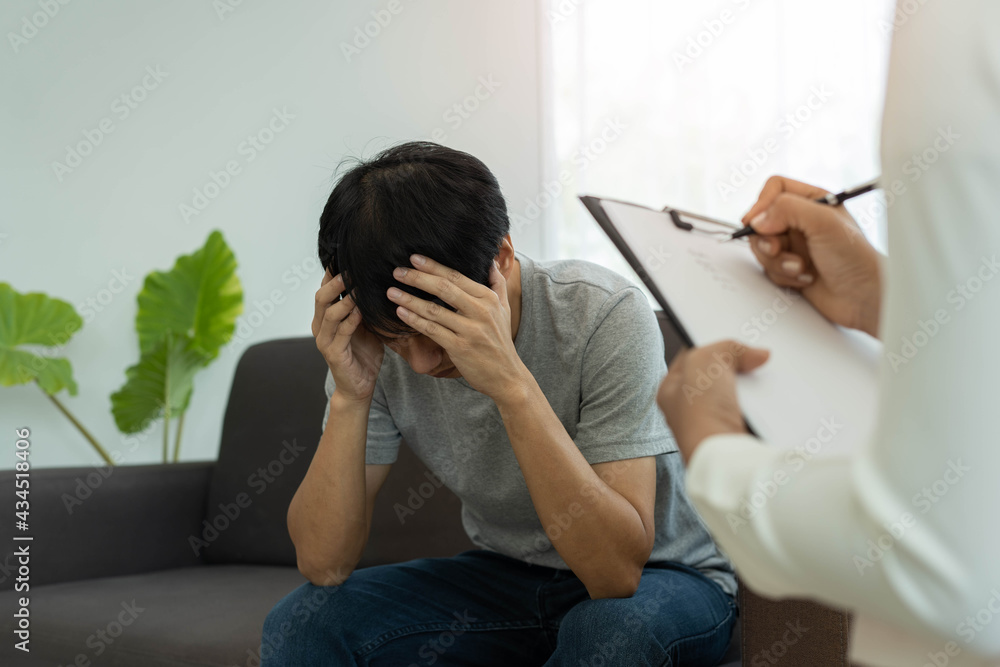 The psychologist talks to the patient and takes notes on the treatment. The patient is addicted to drugs, is stressed and frustrated with life problems. The psychologist talks to the patient and takes notes on the treatment. The patient is addicted to drugs, is stressed and frustrated with life problems.
