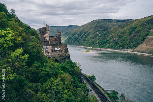 The imposing Rheinstein Castle on the rushing Rhine