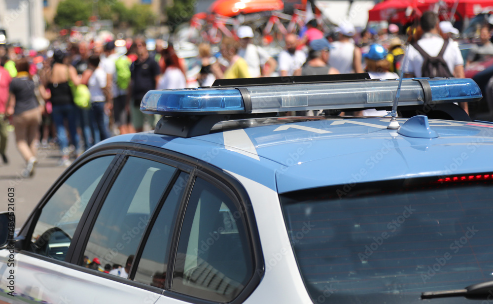 Police car in the crowd during an unauthorized demonstration Police car in the crowd during an unauthorized demonstration