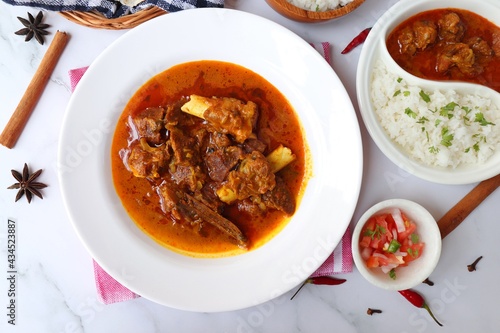 Shahi Mutton curry, Mutton masala, Mutton korma is a famous Spicy non-vegetarian dish of India. It's made out of Goat meat along with spices. Served with rice and roti. copy space.