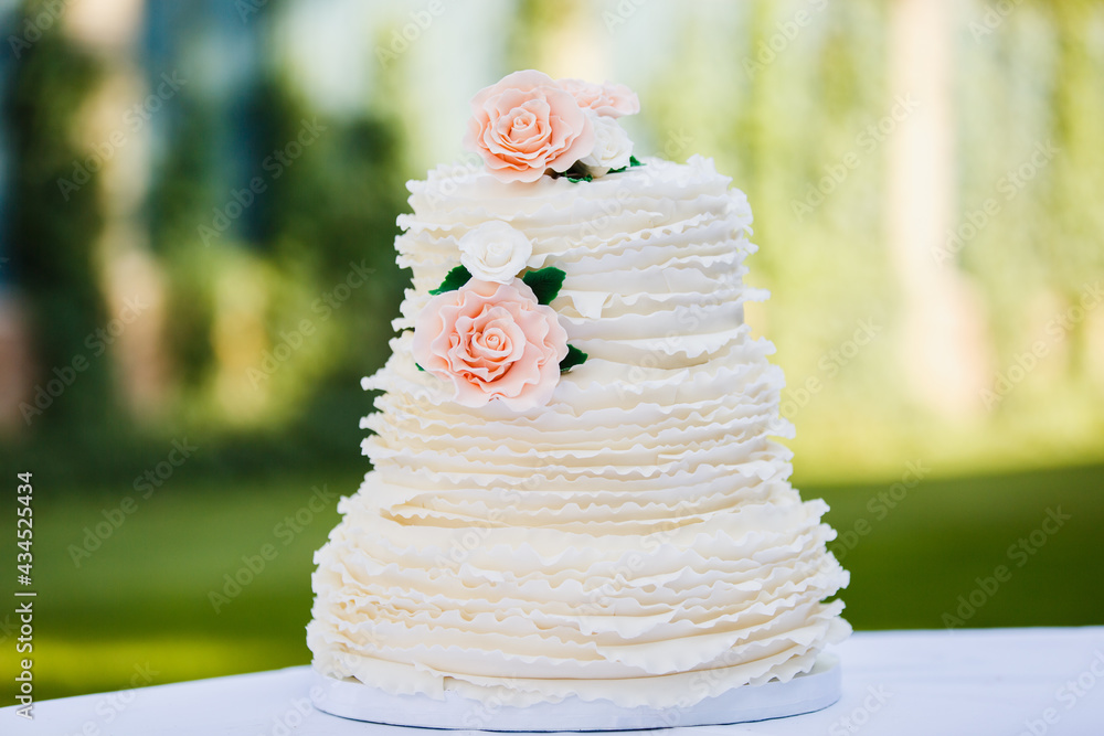 Beautiful big wedding cake with three storey decorated by tender sweet ...