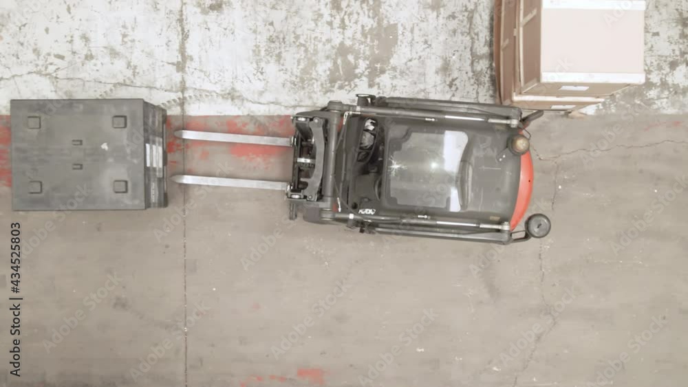 Aerial Top view of a forklift, cargo at industrial warehouse factory. Process loading on logistic warehouse at manufacturing factory. High quality 4k footage Aerial Top view of a forklift, cargo at industrial warehouse factory. Process loading on logistic warehouse at manufacturing factory. High quality 4k footage