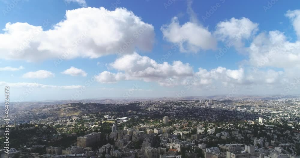 Aerial fly over Jerusalem with villages and settlements view. showing the wonder of co-existing living in cityscape with famous landmark against blue sky Aerial fly over Jerusalem with villages and settlements view. showing the wonder of co-existing living in cityscape with famous landmark against blue sky