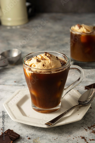 Ice cream with coffee in glass cup. Coffee affogato drink.