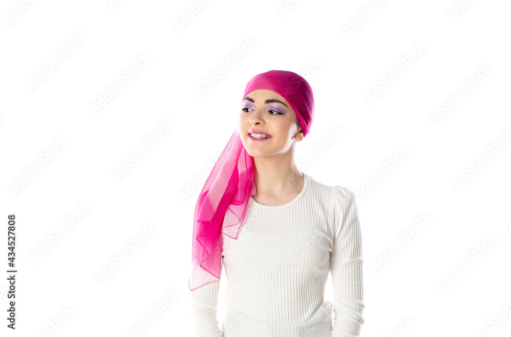 Young brunette woman wearing pink head scarf Young brunette woman wearing pink head scarf