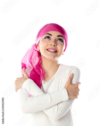 Young brunette woman wearing pink head scarf photo