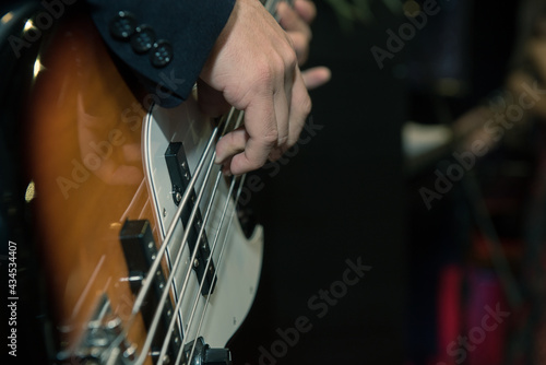 фотографія Man playing bass in low tone