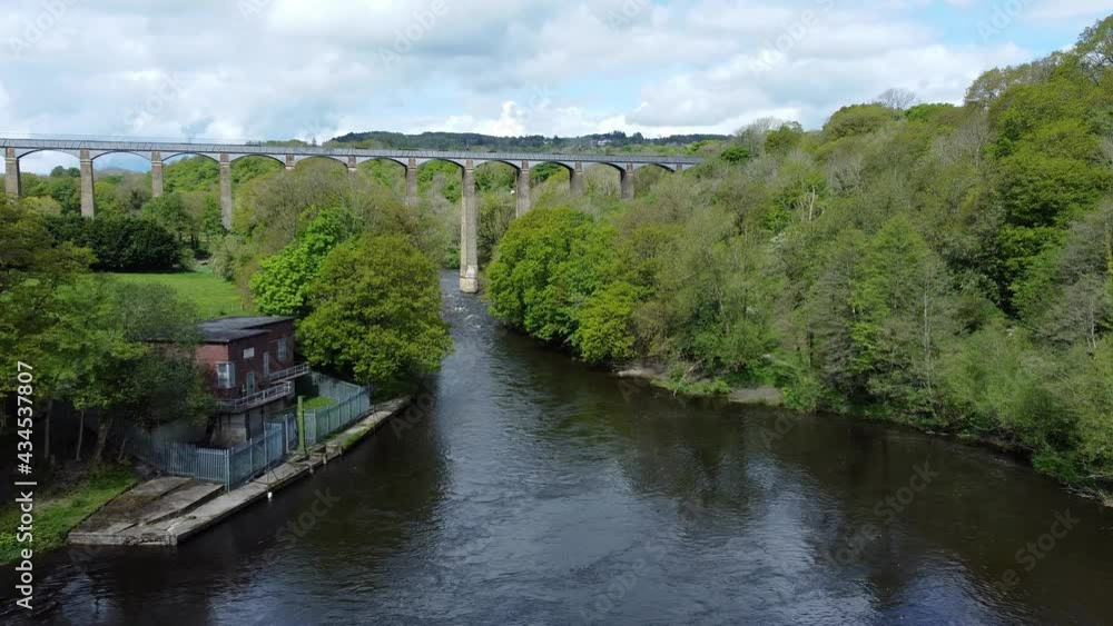 Aerial view Pontcysyllte aqueduct and River Dee canal narrow boat bride in Chirk Welsh valley countryside zoom in low angle Aerial view Pontcysyllte aqueduct and River Dee canal narrow boat bride in Chirk Welsh valley countryside zoom in low angle