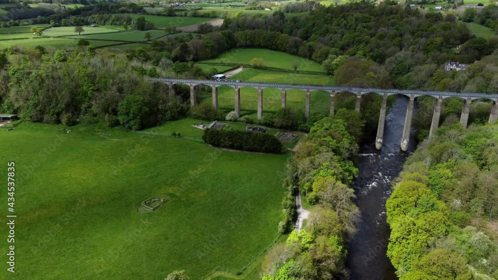 Aerial view Pontcysyllte aqueduct and River Dee canal narrow boat bride in Chirk Welsh valley countryside dolly left Aerial view Pontcysyllte aqueduct and River Dee canal narrow boat bride in Chirk Welsh valley countryside dolly left
