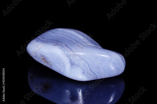 Macro mineral blue agate sapphirin in the rock on black background