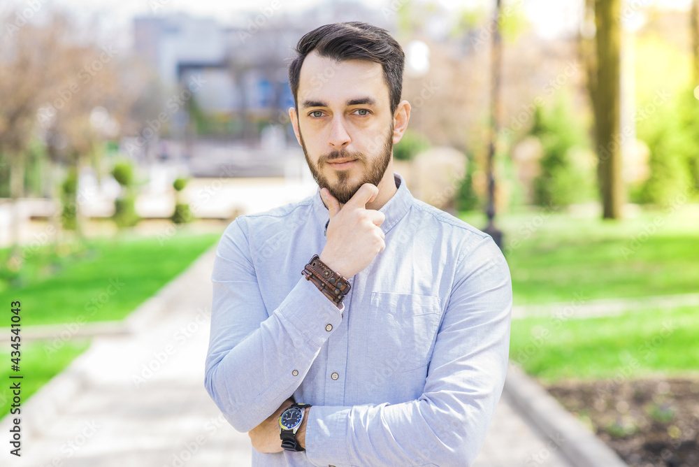 Portrait of a pensive businessman with a beard on a sunny day Portrait of a pensive businessman with a beard on a sunny day