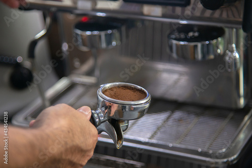 barista scoop grind coffee bean for make espresso shot
