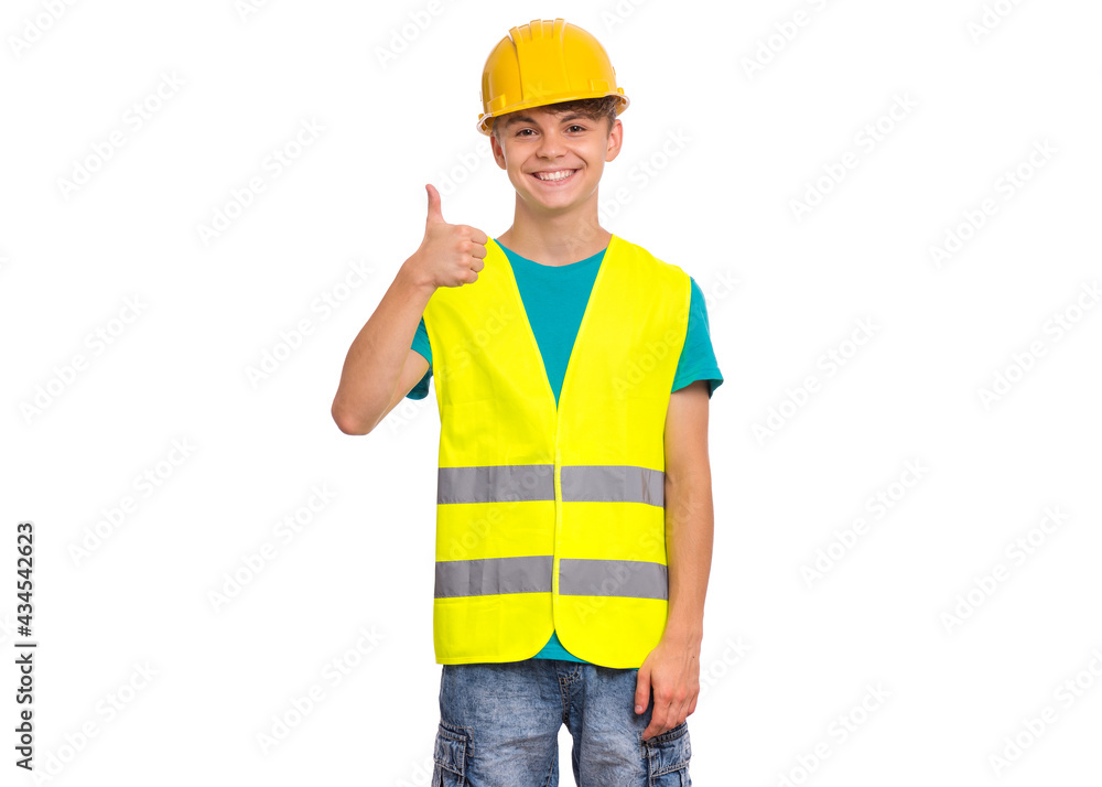 Emotional portrait of handsome teen boy wearing safety jacket and yellow hard hat. Happy child looking at camera, isolated on white background. Funny cute guy - construction Emotional portrait of handsome teen boy wearing safety jacket and yellow hard hat. Happy child looking at camera, isolated on white background. Funny cute guy - construction