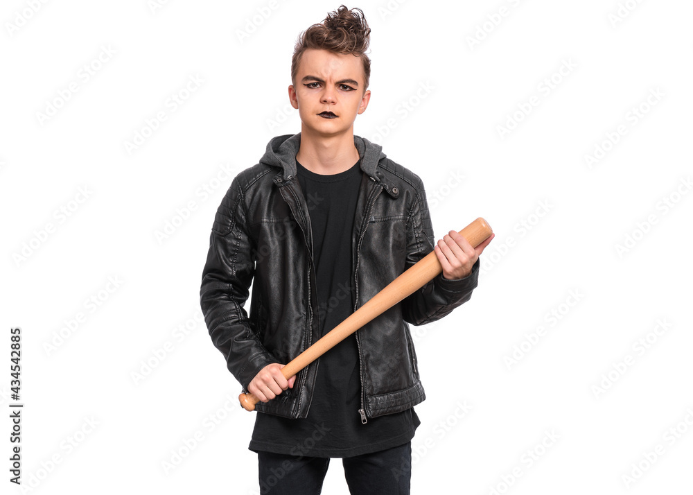 Rebellious teen boy dressed in black, isolated on white background. Young teenager in style of punk goth wearing leather jacket, holding wooden bat. Problems of transitional age Rebellious teen boy dressed in black, isolated on white background. Young teenager in style of punk goth wearing leather jacket, holding wooden bat. Problems of transitional age