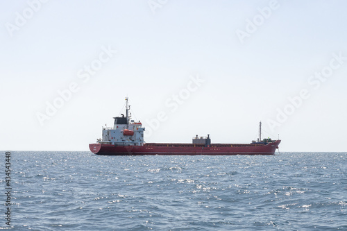 A large cargo ship is in the roadstead in the waters of the Haifa Bay in the Mediterranean Sea  near the port of Haifa in Israel