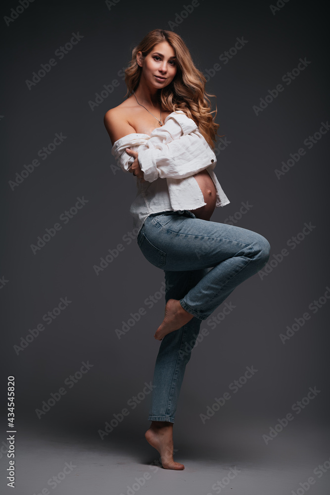 Young beautiful pregnant woman white shirt Young beautiful pregnant woman white shirt