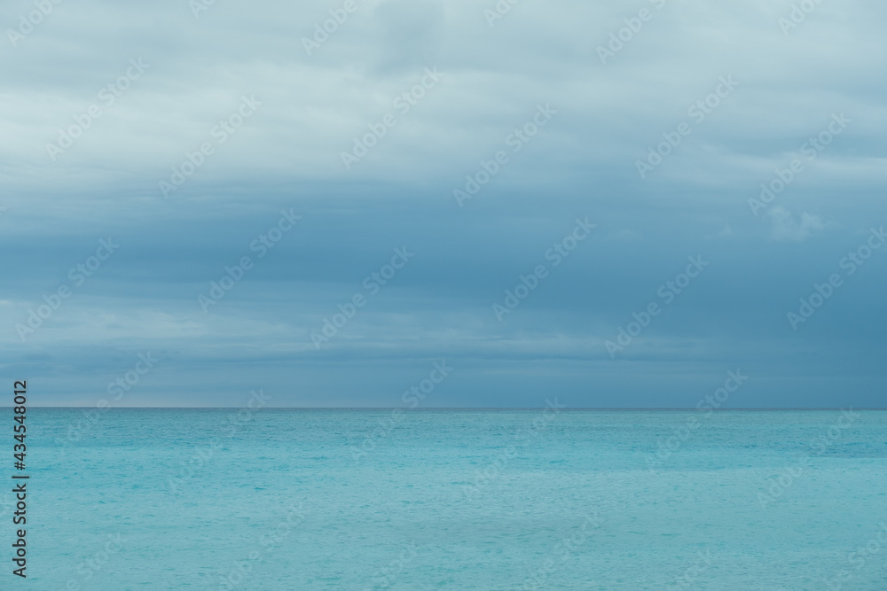 Cloudy stormy weather with sea and skyline at french riviera on rainy day. Horizontal high quality photography. Storm approaching the sea in Nice, France. High quality photo 