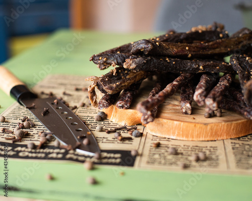 Biltong (dried meat) being cut photo