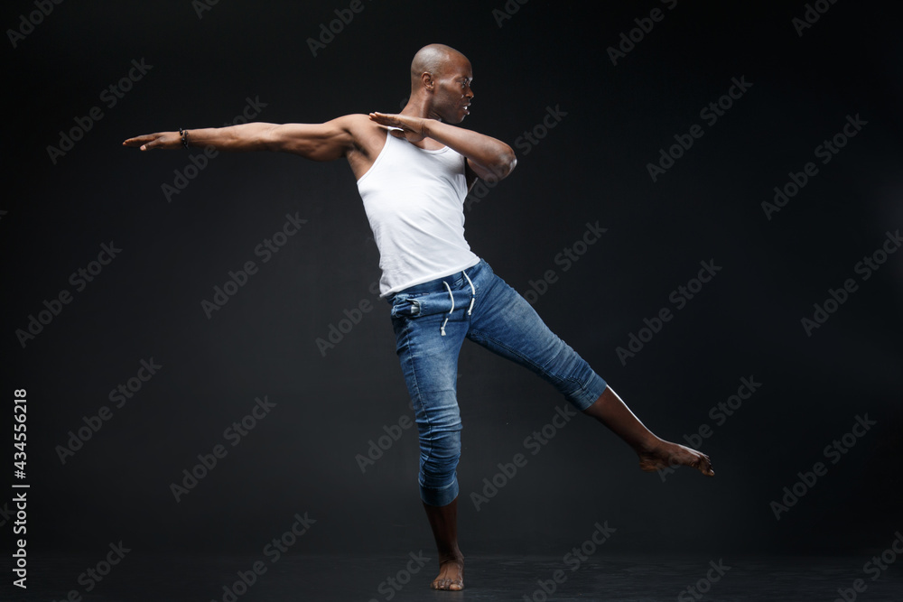 Dancing black man on a black background.
