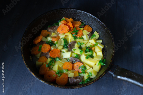 frying pan with vegetables and beeaf
