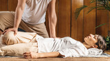 Thai Massage Technique - Assisted Spine Twist in Lying Position