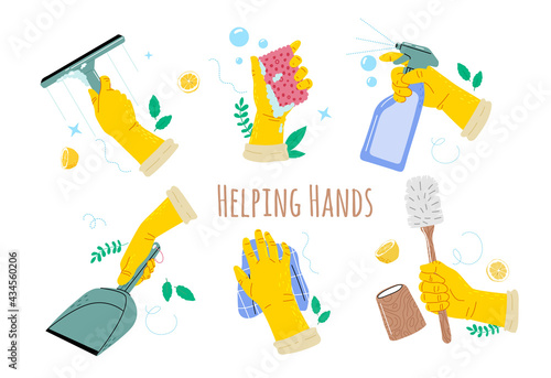 Hands in yellow gloves holding a cleanings tools toilet brush, sponge,windows spray, domestic,windows cleanser, scraper.
