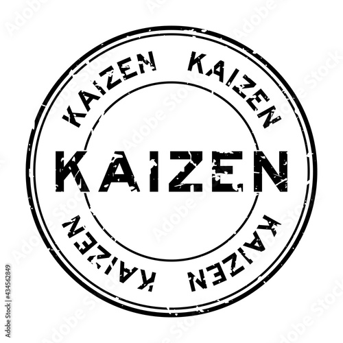Grunge black kaizen word round rubber seal stamp on white background