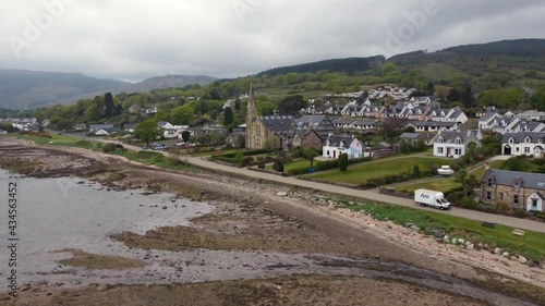 Aerial view of the Scottish town of Lamlash on the Isle of Arran on an overcast day, Scotland. Right to left elevating view over town. photo