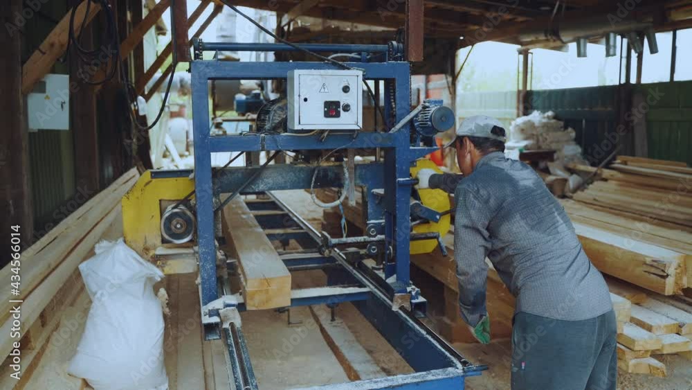 A worker at a woodworking machine A worker at a woodworking machine