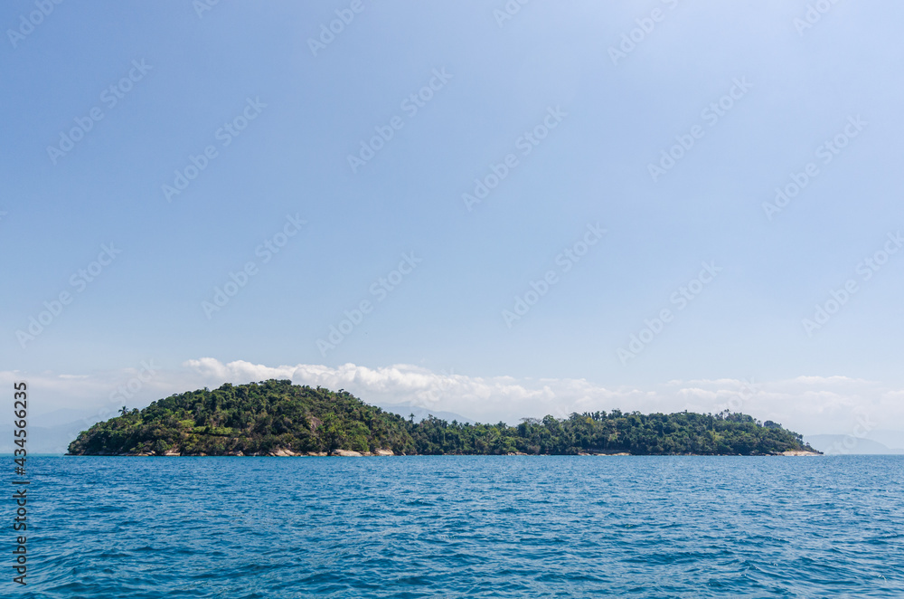 Coastline scenic view with blue sky and sea. Summer vacation day at Paraty's sea.