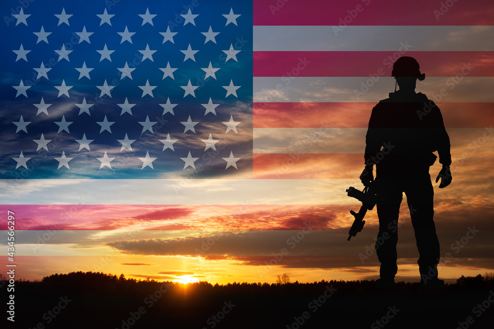 Silhouette of a soldiers against the sunrise and flag USA. Concept - protection, patriotism, honor.