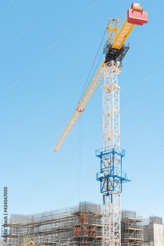 Construction site with a big tower crane. Construction site with a big tower crane.